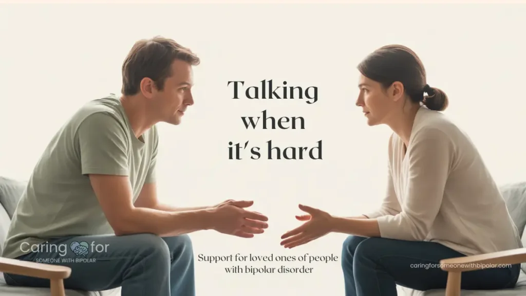 Two adults sitting on a couch having a calm, supportive conversation about bipolar disorder.